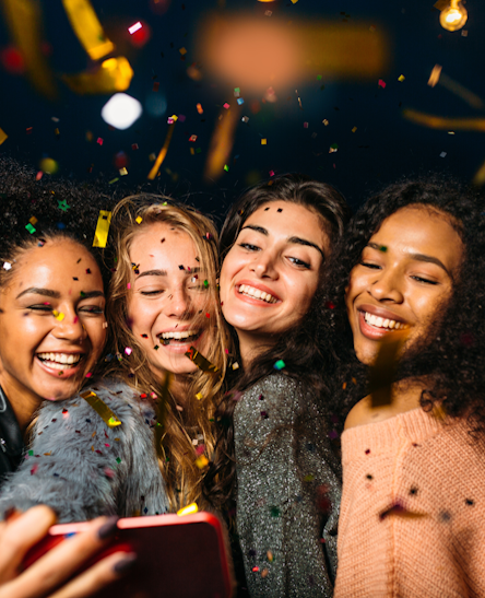 Happy people sharing memories on their phones